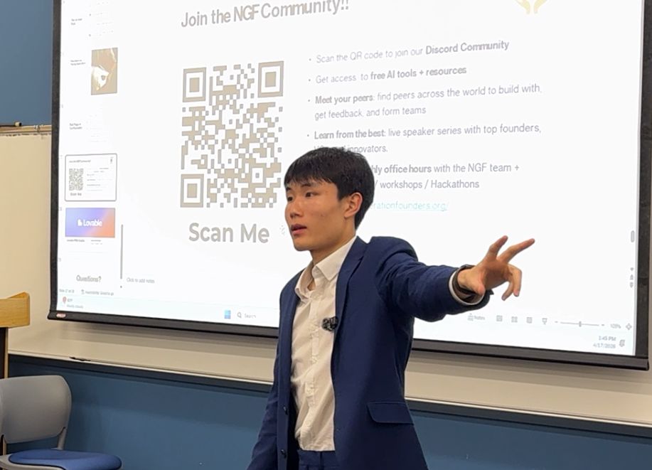 An NGF facilitator showing students how to join the community and access free tools